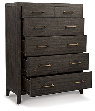 Few pieces demand attention like the Bellvern chest of drawers. Those drawn to the earthy character of the wire-brushed texture—with a complex, multi-layered finish—can appreciate the beauty and craftsmanship of this bedroom essential. In addition to its acacia wood and oak veneer construction, clean contemporary lines and simple symmetry have a minimalist appeal that fits perfectly in an upscale transitional setting.Made of acacia wood, oak veneer and engineered wood | Blackened effect finish with contrasting gray undertones and wire-brushed texture | Antiqued bronze-tone hardware | 6 smooth-gliding drawers with dovetail construction | Top drawers felt-lined | Assembly required | Estimated Assembly Time: 30 Minutes