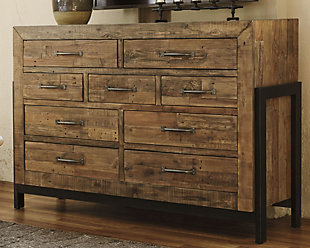Load up on character. Scale back on fuss. As the Sommerford dresser proves to perfection—less is more. Crafted of reclaimed pine, its ultra clean-lined, chunky profile showcases long butcher-block planking rich with tonal variation, nicks, notches, nail holes and a whole lot of raw beauty. Numerous drawers offer ample room for a wardrobe.Dresser only | Made with reclaimed pine wood | Light grayish brown finish | Silver/bronze-tone hardware | 9 smooth-operating drawers with dovetail construction | Metal leg brackets with stretcher | Assembly required | Includes tipover restraint device | Estimated Assembly Time: 45 Minutes