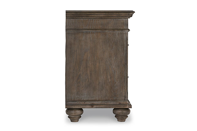 Homey. Hearty. Heavenly hued. Luring with a distressed weathered gray finish and substantial mouldings for great presence, the Johnelle nightstand is sure to make your homestead feel that much more like home. Solid wood is beautified with elm veneers for a master suite masterpiece made for years of satisfaction. Dark pewter-tone nailhead trim adds to the richly rustic aesthetic.Made of elm veneers, acacia wood and engineered wood | Distressed weathered gray finish | 3 smooth-gliding drawers with dovetail construction; top drawer felt-lined | Dark pewter-tone hardware | Includes tipover restraint device | Estimated Assembly Time: 15 Minutes