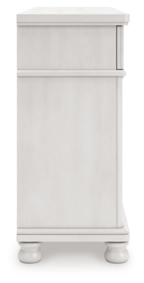 White distressed dresser with four small top drawers and two rows of larger drawers below, round ring pulls, and bun feet.