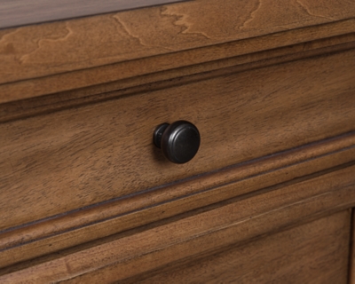 Wooden dresser drawer with black round knob