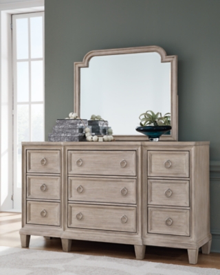 Jorlaina 9 Drawer Dresser and Mirror, Light Grayish Brown