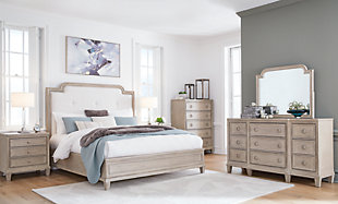 Jorlaina Queen Upholstered Panel Bed with Mirrored Dresser, Chest and 2 Nightstands, Light Grayish Brown, rollover