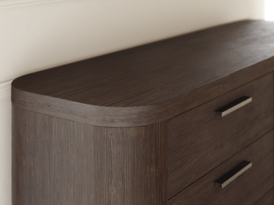 Close-up of dresser top and corner showing wood grain
