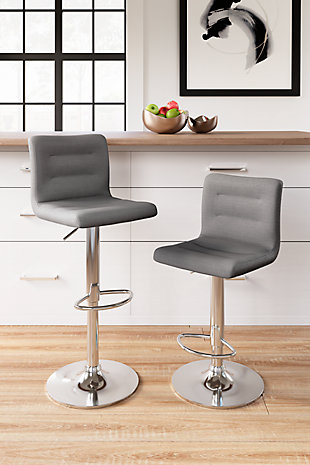 Have a taste for highly contemporary style? You’re sure to find the posh and polished Pollzen bar stool something to savor. Crafted with a sturdy steel frame beautified with a brilliant chrome-tone finish, this designer bar stool caters to your comfort with an adjustable height feature and swivel pedestal base. The cushioned seat and backrest are covered in a feel-good gray woven upholstery with channeled details that enhance its modern appeal.Sturdy steel frame in chrome-tone finish | Gray woven polyester upholstery over foam cushioned seat | Channel stitched details | Swivel pedestal base | Adjustable height | Comfortable footrest | Assembly required | Estimated Assembly Time: 30 Minutes