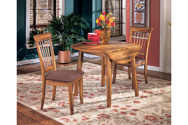The Berringer dining room table incorporates decidedly rustic flair. Two drop leaves provide just enough table space to accommodate the drop-in guest. Simple and clean lined, with stylish stilted legs, it’s a look that easily fits, whether your aesthetic is vintage, country or traditional.Made of veneers, wood and engineered wood | Hinged extension leaves | Seats up to 4 | Assembly required | Dining chairs sold separately | Estimated Assembly Time: 15 Minutes
