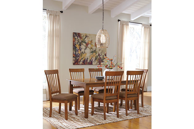 The Berringer 7-piece dining room set incorporates decidedly rustic flair. Simple and clean lined, with stylishly tapered legs, it’s a look that easily fits, whether your aesthetic is vintage, country or traditional. Upholstered side chair has a classic spindle back and seat covered in easy-to-maintain microfiber.Includes dining table and 6 chairs | Assembly required | Table made of veneer, wood and engineered wood with rustic brown finish | Seats up to 6 | Chairs made of wood with rustic hand-applied finish | Cushioned seat with microfiber upholstery | Estimated Assembly Time: 195 Minutes
