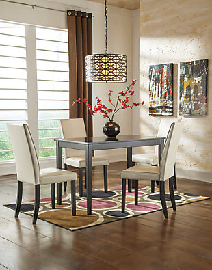 The Kimonte dining table set might be big on style, but its petite scale is ideally suited for small spaces. Dark finish and minimalist design make Kimonte the epitome of contemporary decor. Four comfortably cushioned high-back chairs covered in an ivory-tone faux leather make it easy to linger at the table.Includes dining table and 4 upholstered chairs | Table made of veneers, wood and engineered wood | Chairs made of wood | Cushioned seats and backs covered in faux leather upholstery | Seats up to 4 | Assembly required | Estimated Assembly Time: 135 Minutes