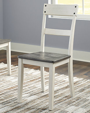 Nelling dining room chair has all the right ingredients for farmhouse-inspired style with a casual vibe. It’s beautifully crafted with a fresh white finish and a dark brown wood tone for gently weathered charm. Inset nail head accents add an industrial element.Made of wood | Two-tone finish (painted white and dark brown oak-tone) | Weathered gray wood grain texture | Metal nailhead accents | Assembly required | Estimated Assembly Time: 30 Minutes