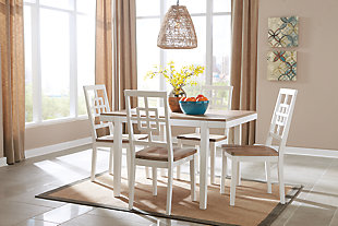 With its delicious two-tone finish, the Brovada dining room table set dishes out a double serving of clean-lined, contemporary style. Tabletop and seats are treated to a light-washed effect with hints of gray for a “weathered” aesthetic—a delightful complement to the fresh, crisp white. Open, airy lattice-back chairs really bring the look home.Includes dining table and 4 chairs | Made of wood and engineered wood | Two-tone finish | Estimated Assembly Time: 90 Minutes