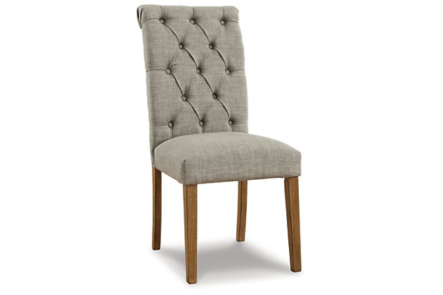 Simple sophistication is closer than ever with the Harvina dining chair. This chair is delightfully cozy with its light gray upholstered seat and carefully tailored button-tufted back, while the rolled top rail provides a little extra flair. The legs are finished in a neutral light walnut color for the finishing touch to this charming chair.Made with solid wood | Legs finished in neutral light walnut color | Light gray textured polyester upholstery | Button-tufted back and rolled top rail | Assembly required | Estimated Assembly Time: 30 Minutes