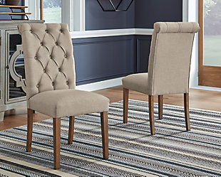 Simple sophistication is closer than ever with the Harvina dining chair. This chair is delightfully cozy with its beige upholstered seat and carefully tailored button-tufted back, while the rolled top rail provides a little extra flair. The legs are finished in a neutral light walnut color for the finishing touch to this charming chair.Made with solid wood | Legs finished in neutral light walnut color | Beige textured polyester upholstery | Button-tufted back and rolled top rail | Assembly required | Estimated Assembly Time: 30 Minutes