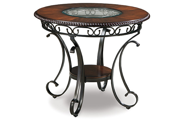 Incorporating a touch of European influence with its scrolled metal accents, the Glambrey 5-piece dining room set mixes various textural elements and rich earth tones in a way that’s so pleasing to the palette. The circular inset glass on the dark finished tabletop serves up light and airy contrast. Whether you’re looking to entertain or simply make the best of your nest, do it with flair.Includes counter-height dining table and 4 counter-height bar stools | Table seats up to 4 | Made of metal, veneers and engineered wood | Hand-finished | Inset glass tabletop | Table with 1 fixed shelf | Base with powder coated finish | Dark cherry-color wood | Dark bronze-tone metal | Chairs with polyester upholstery over foam cushion | Assembly required | Estimated Assembly Time: 60 Minutes