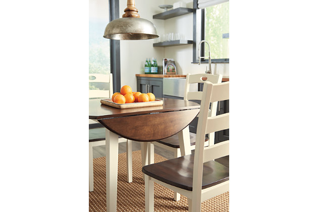 Turn your eat-in kitchen or dining space into a cottage-chic retreat with the Woodanville round dining table set. Two-tone finish serves up a double helping of charm. Chairs' pierced ladderback design is equally sweet and sophisticated.Includes drop leaf dining table and 4 dining chairs | Made of replicated veneers and engineered wood | Two-tone finish | Hinged drop leaves | Assembly required | Estimated Assembly Time: 135 Minutes