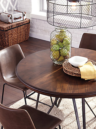 With its distinctive tubular metal base, the Centiar dining table serves up a fresh twist on mid-century inspired style. The mixed materials and two-tone aesthetic are beautifully in balance. What a timeless look for eat-in kitchens and casually cool dining rooms.Tabletop made with mindi veneer and engineered wood | Metal base with brushed dark bronze-tone finish | Assembly required | Dining chairs sold separately | Estimated Assembly Time: 30 Minutes