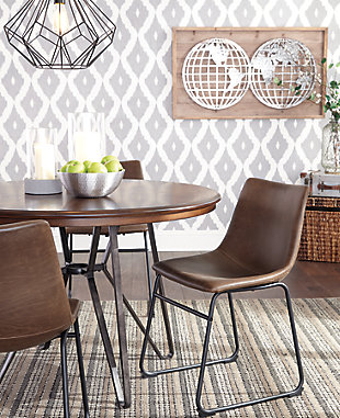 With its distinctive tubular metal base, the Centiar dining table set serves up a fresh twist on mid-century inspired style. The mixed materials and two-tone aesthetic are beautifully in balance. What a timeless look for eat-in kitchens and casually cool dining rooms.Includes dining table and 4 dining chairs | Tabletop made with mindi veneer and engineered wood | Metal table base with brushed dark bronze-tone finish | Bar stools with tubular metal base, bucket seat and faux leather upholstery | Assembly required | Estimated Assembly Time: 150 Minutes