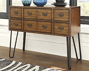 Rustic meets mid-century for a modern look in this versatile sideboard. Grainy wood paired with curved metal legs offers a mix of texture that is intriguing and simple. Stylish and practical, this statement piece with six smooth-gliding drawers allows for necessary storage from the living room and dining room.Made of veneers, wood, engineered wood and metal | 6 drawers | Dark bronze pulls | Assembly required | Excluded from promotional discounts and coupons | Estimated Assembly Time: 15 Minutes
