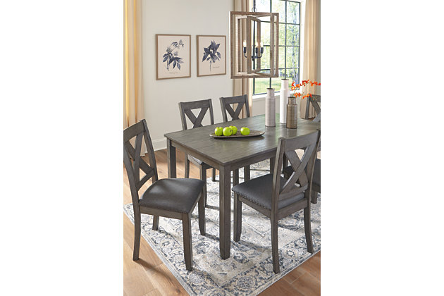 Perfect portion. Striking a simply chic pose, the Caitbrook dining set is styled with fascinating flair. Subtle gray wash finish gives the clean-lined design a casually cool sensibility, while the chair’s plushly cushioned seat in a soft, neutral upholstery adds to the allure.Includes dining table and 6 chairs | Table made of wood, acacia veneer and engineered wood; chairs made of wood | Antiqued gray wash finish | Foam cushioned seat with linen-weave polyester upholstery | Nailhead accents | Assembly required | Estimated Assembly Time: 60 Minutes