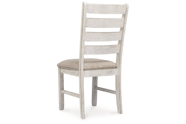 The Skempton dining chair invites you to raise the bar for small space living. An inspired choice for coastal chic or modern farmhouse settings, this comfortably cushioned chair sports a grayish white finish with rub through effect for timeworn appeal.Made of wood and engineered wood | Distressed grayish white finish | Cushioned seat with polyester upholstery | Tall ladderback design | Assembly required | Estimated Assembly Time: 30 Minutes