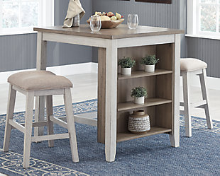 The Skempton counter height table and bar stool set invites you to raise the bar on small space living. An inspired choice for coastal chic or modern farmhouse settings, this clean-lined, simply striking set doubles the charm with brown tone plank effect tops, paired with grayish white bases with rub through effect for timeworn appeal. The table’s built-in open shelves make the most of every inch of space.Includes counter height table and 2 bar stools | Made of wood, acacia veneer and engineered wood | Distressed grayish white finish | Cushioned seat with polyester upholstery | 3 open shelves | Assembly required | Estimated Assembly Time: 60 Minutes