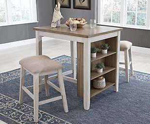 The Skempton counter height table and bar stool set invites you to raise the bar on small space living. An inspired choice for coastal chic or modern farmhouse settings, this clean-lined, simply striking set doubles the charm with brown tone plank effect tops, paired with grayish white bases with rub through effect for timeworn appeal. The table’s built-in open shelves make the most of every inch of space.Includes counter height table and 2 bar stools | Made of wood, acacia veneer and engineered wood | Distressed grayish white finish | Cushioned seat with polyester upholstery | 3 open shelves | Assembly required | Estimated Assembly Time: 60 Minutes