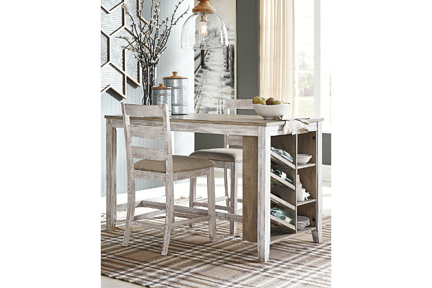 The Skempton counter height table with storage invites you to raise the bar on small space living. An inspired choice for coastal chic or modern farmhouse settings, this clean-lined, simply striking table doubles the charm with a brown tone top with plank effect, paired with a grayish white base with rub through effect for timeworn appeal. Built-in 8-bottle wine rack and pair of open shelves make the most of every inch of space.Made of solid wood, engineered wood and acacia veneers | Two-tone finish | 2 shelves | 8-bottle wine rack | Seats up to 4 | Assembly required | Estimated Assembly Time: 30 Minutes