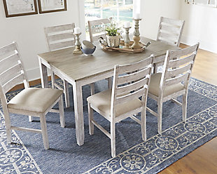 Set the scene for coastal chic or modern farmhouse living with the Skempton dining room table set. Clean-lined, simply striking table doubles the charm with a brown tone top with plank effect, paired with a grayish white base with rub through effect for timeworn appeal. Six chairs with classic ladderback styling and comfortably upholstered seats make room for one and all.Includes rectangular table and 6 chairs | Made of solid wood, engineered wood and acacia veneers | Two-tone finish | Seats up to 6 | Assembly required | Estimated Assembly Time: 90 Minutes