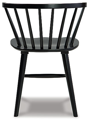 Sleek and simple, the solid black finish of the Otaska dining chair is sure to impress. With a low spindle back and turned legs, this chair proves minimalism can make a big statement. Made with solid wood | Solid black finish | Low spindle back | Turned legs | Sturdy "H" stretcher | Assembly required | Estimated Assembly Time: 30 Minutes