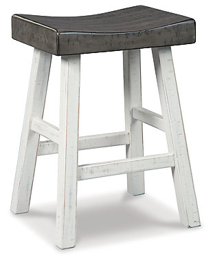 Saddle up and prepare to feast in total comfort and style. The Glosco counter height saddle stool's deeply scooped seat offers ample support through multiple courses (or rounds of drink). Contrasting finishes elevate the classic shape, creating a look that keeps you coming back for seconds.Made of wood | Two-tone finish (antiqued white base and medium brown wood tone seat) | Saw kerf distressing | Comfortable footrest | Counter height | Assembly required | Estimated Assembly Time: 30 Minutes