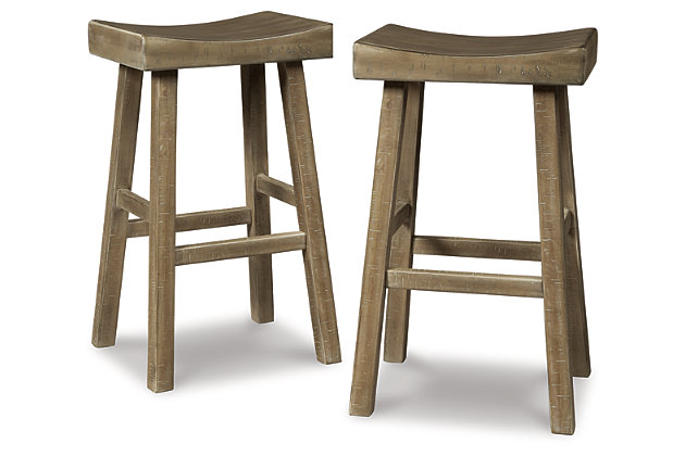 Saddle up and prepare to feast in total comfort and style. The Glosco pub height saddle stool's deeply scooped seat offers ample support through multiple courses (or rounds of drink). Contrasting finishes elevate the classic shape, creating a look that keeps you coming back for seconds.Made of wood | Natural finish (light weathered barn wood color) | Saw kerf distressing | Comfortable footrest | Pub height | Assembly required | Estimated Assembly Time: 30 Minutes