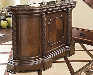 The well-appointed North Shore bar makes for stylish, effortless entertaining. Drinks and appetizers appear more tasteful when presented on beautifully veined marble surface. Multiple drawers and storage areas hold a variety of serving and prepping utensils, stemware and bottles, including a rack dedicated to 12 bottled varieties.Hand-finished | 1 adjustable shelf | Made of veneers, wood, engineered wood, natural marble parquetry and cast resin | 1 pull-out tray with laminate top | Assembly required | 3 drawers | 1 cabinet with 1 adjustable shelf | Antiqued goldtone hardware | 12-bottle wine rack