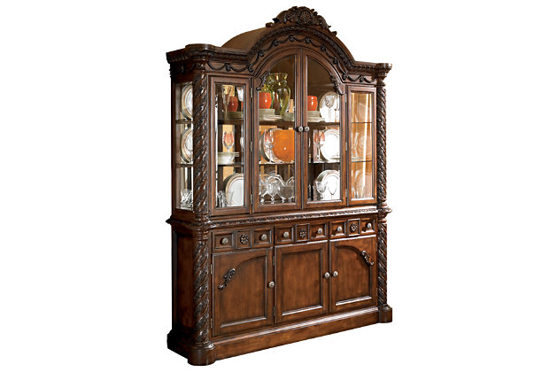 Inspired by the grandeur and grace of Old World traditional style, the North Shore china cabinet is nothing short of stunning. A choice blend of materials is accented by the most intricate carvings and appliques. Designed for modern convenience, the illuminated hutch with mirrored back and glass shelves makes for gorgeous displays.Made of veneers, wood, engineered wood and cast resin | Hand-finished | Antiqued goldtone hardware | Hutch with 2 glass doors and 3 shelves; LED lighting (3-way switch located on outer door hinge controls the light) | Assembly required | Upper cabinet only; buffet sold separately | Excluded from promotional discounts and coupons