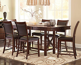Craftsmanship with attention to detail makes the Collenburg counter height extension table perfect for casual dining. Simply add in the separate leaf for more space at the table. Its rich brown finish and decorative nailhead trim adorn this table with beauty. The braced legs, metal accents and lower shelf create a robust look with a hint of industrial style.Made of veneers, wood and engineered wood | Dark brown finish | Counter height | Nailhead trim | Separate extension leaf | Table extends by pulling both ends and dropping in leaf | Table base with 1 fixed shelf | Seats up to 8 | Assembly required | Dining chairs sold separately | Estimated Assembly Time: 30 Minutes