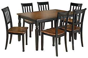 The farmhouse table is more in style than ever—and the Owingsville 7-piece dining room set brings it back in brilliant fashion. The rectangular table and 6 chairs don a subtle two-tone finish for a look that's equally homey and sophisticated. Vintage inspiration at its best.Includes dining table, 6 chairs  | Table and chairs made of veneers, wood and engineered wood | Table top and chair seats are finished in a burnished brown color | Table bases and chair frames are finished in cottage black paint | Assembly required