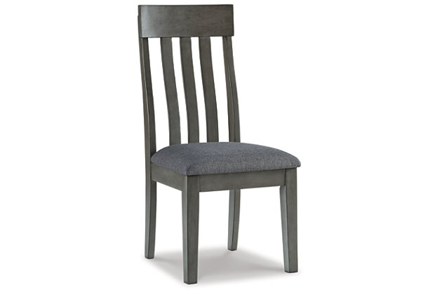 Cool and on-trend. The Hallanden upholstered dining chair sports a two-tone gray look for a contemporary-yet-casual feel. The cushioned foam seat in a gray textural fabric pairs seamlessly with the antiqued gray finish, while the contoured comb-back design adds a dash of geometric flair. With this chic seat, it’s easy to dine in style.Made with solid wood | Antiqued gray finish | Upholstered in gray textural polyester fabric | Cushioned foam seat | Contoured comb-back design | Assembly required | Estimated Assembly Time: 30 Minutes