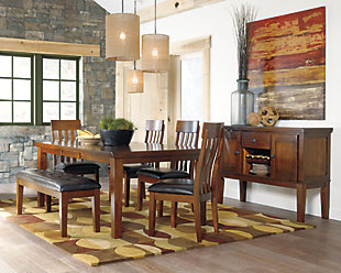 Have an appetite for clean-lined design, but with warmth and rustic character? Satisfaction is served with the Ralene dining room extension butterfly table. We love how its gently distressed, burnished finish and plank-style tabletop incorporate depth and character. And its straightforward lines? A wonderful display of good taste.Made of veneers, wood and engineered wood | 1 self-storing butterfly extension leaf | Seats up to 8 | Assembly required | Dining chairs sold separately | Estimated Assembly Time: 30 Minutes