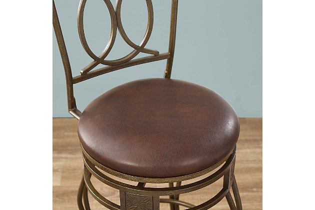 With its scrolled metalwork and fanciful flair, this bar stool with swivel serves up style with a more traditional twist. Complete with a thickly padded seat covered in easy-care vinyl, this swivel bar stool will surely elevate the form and function of a kitchen island area, breakfast bar or entertainment space.Made of bronze-tone metal with wood cap | Brown vinyl upholstery | Foam cushioned seat | Swivel seat | Protective glides under legs | Assembly required