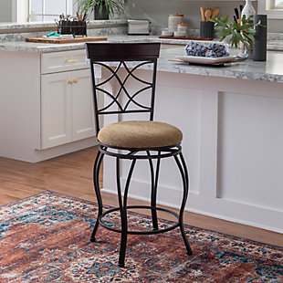 With its scrolled metalwork and fanciful flair, this bar stool with swivel serves up style with a more traditional twist. Complete with a thickly padded seat covered in a low-maintenance microfiber, this swivel bar stool will surely elevate the form and function of a kitchen island area, breakfast bar or entertainment space.Made of metallic brown metal with wood finished cap | Polyester microfiber upholstery | Foam cushioned seat | Swivel seat | Protective glides under legs | Assembly required