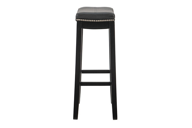 Raise the bar on style with this simply striking upholstered bar stool in black with black upholstery. Thickly padded seat covered in easy-clean vinyl caters to your comfort level.Made of wood | Black finish | Faux leather upholstery with foam padding | Contoured saddle seat | Nailhead trim | Footrest | Protective glides under legs | Assembly required