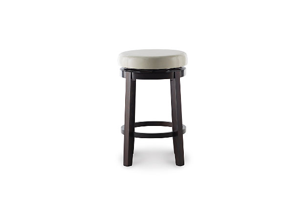 Raise the bar on style with this simply striking upholstered bar stool in dark brown with cream upholstery. Thickly padded seat covered in easy-clean vinyl caters to your comfort level.Made of wood | Dark brown finish | Faux leather upholstery with foam padding | Nailhead trim | Protective glides under legs | Assembly required