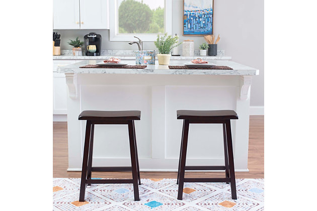Sleekly styled with a dark brown finish and a contoured saddle seat, this bar stool is quite the head turner. And with a simple backless design, it slides neatly under the table when not in use.Made of wood | Dark brown finish | Contoured saddle seat | Protective glides under legs | Assembly required