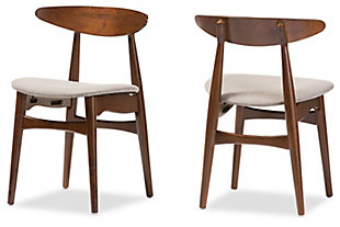 Serve up a high-end Scandinavian furniture look at a price that’s well within budget with this set of two dining chairs. Quality crafted of solid wood, this pair of designer chairs is a feast for the eyes and tempting to the touch. Plushly padded seats are wrapped in a textural gray fabric that’s sure to please.Set of 2 | Made of wood | Gray polyester upholstery | Foam cushioned seat | Assembly required