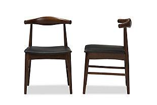 Serve up a high-end Scandinavian furniture look at a price that’s well within budget with this set of two dining chairs. Quality crafted of solid wood beautified with a walnut-tone finish, this pair of designer chairs is a feast for the eyes and tempting to the touch. Plushly padded seats are wrapped in a practical black faux leather that’s sure to please.Set of 2 | Made of wood in walnut-tone finish | Black faux leather upholstery | Foam cushioned seat | Assembly required