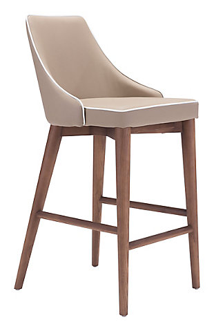 Create an effortlessly elegant look with this upholstered designer bar stool with slim wing back styling. Back and seat are wrapped in a feel-good faux leather punctuated with accent trim detail. Sturdy all-wood base in a warm walnut-tone finish makes a striking complement.Wood base in walnut-tone finish | Padded faux leather upholstery | Assembly required