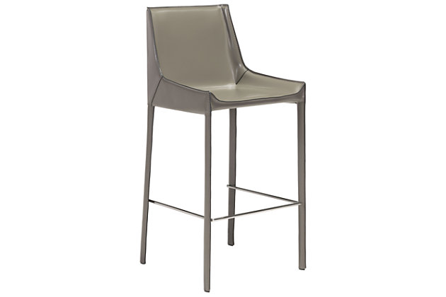 Streamlined and sleek, this bar stool features a slim profile with rich leather upholstery showcasing an exposed seam aesthetic stretching from high back to feet. Accented with sturdy chrome-tone footrest.Set of 2 | Sturdy steel base | Leather upholstery | Exposed seam details
