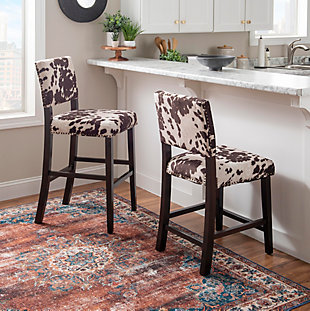 The Wes cow print bar stool has a classic traditional style accented with transitional flair. The stool has a bold cow print plush upholstered seat and back embellished with antique bronze-tone nailhead trim. The straight lined legs are finished in a Manhattan stain. Perfect for a kitchen counter, bar or island.Made of wood and mdf | Ca fire foam cushioned seat | Antique bronze-tone nailhead trim | Manhattan stain finish | Microfiber udder nadness brown fabric | Seat dimensions: 24" seat height, 18.74" x 19.76" x 4.53" | 275 lb. Weight limit | Assembly required