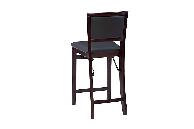 This high-style folding stool adds an extra dash of elegance to your dining or entertaining arrangement. The wood frame features a comfy padded seat and back and easy-clean vinyl upholstery with a leather look. Front and rear supports provide extra stability. This space-saving stool folds for easy setup and storage.Made of plywood, rubberwood and pvc | Rich espresso finish | Dark brown vinyl padded seat with ca fire foam | Folds for easy set up and storage | Front and rear supports provide extra stability | Seat dimensions: 24" seat height, 15.35" x 16.93" x 1.77" | Counter height | Fully assembled