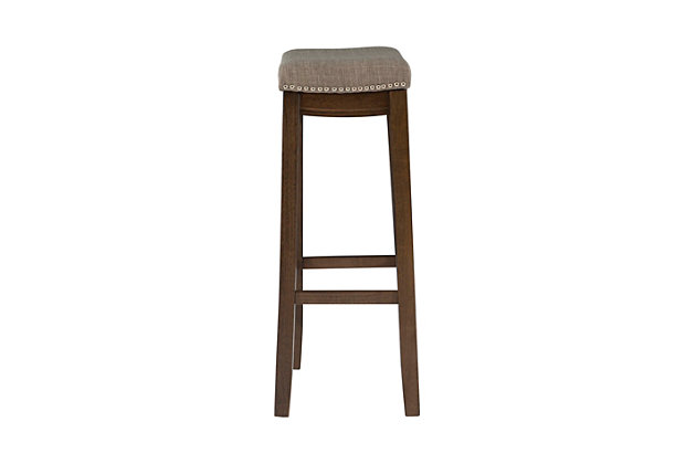 Add timeless style and cozy comfort to your counter or high top table with the Claridge backless barstool. Crafted from sturdy wood in a black finish, this simply chic stool is upholstered in a gray vinyl fabric and embellished with shiny silvertone nailhead trim for eye-catching detail. Counter height.Made of wood | Black finish | Shiny silvetone nailhead trim | Gray vinyl upholstered seat | Seat dimensions: 24" seat height, 16.93" x 11.81" x 2.76" | 275 lb. weight limit | Foam cushion | Assembly required