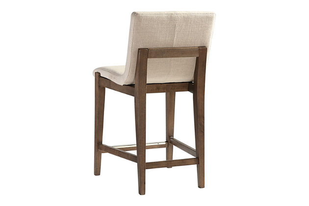 Take modern comfort to a new level with this beautifully upholstered bar stool that's quality built with a walnut-tone birch wood frame with a contrasting brushed nickel-tone metal kick plate. Rest assured, this cool, contemporary bar stool with neutral, linen blended fabric is sure to be a savory addition to your kitchen or dining area. Solid birch frame with light walnut finish | Plywood; foam padded seat | Neutral, linen-blend fabric | Brushed nickel-tone metal kick plate  | 26" height | Assembly required
