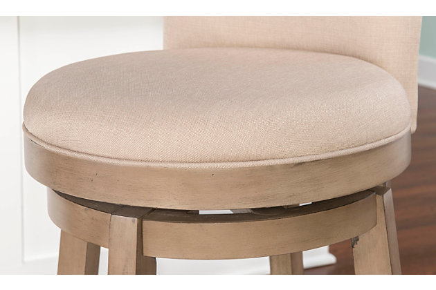 The Big & Tall Jordan Counter Stool has a rustic, yet elegant look that offers instant style to your home decor. Upholstered in a natural linen-look fabric with a rounded back and circular seat, this graceful stool is both comfortable and fashion forward. Restoration finish. Some assembly required.Comfortable and fashionable | The seat is upholstered in a natural linen-look fabric | Some assembly required